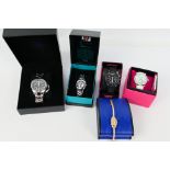 A collection of boxed fashion wrist watc