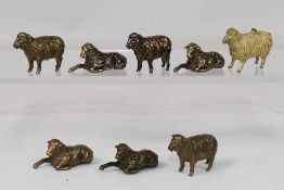 8 x small bronze sheep figures. All in s