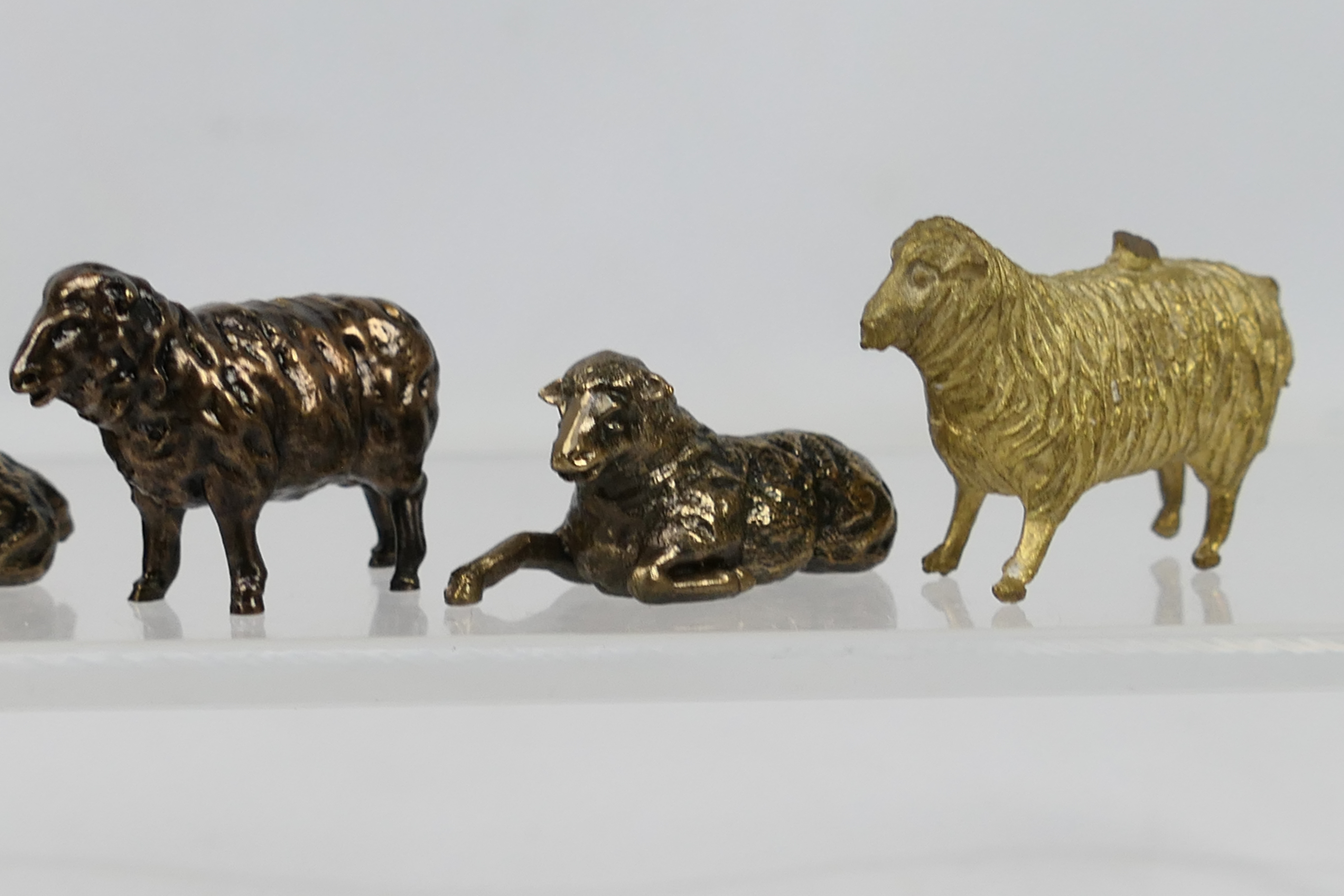 8 x small bronze sheep figures. All in s - Image 3 of 5