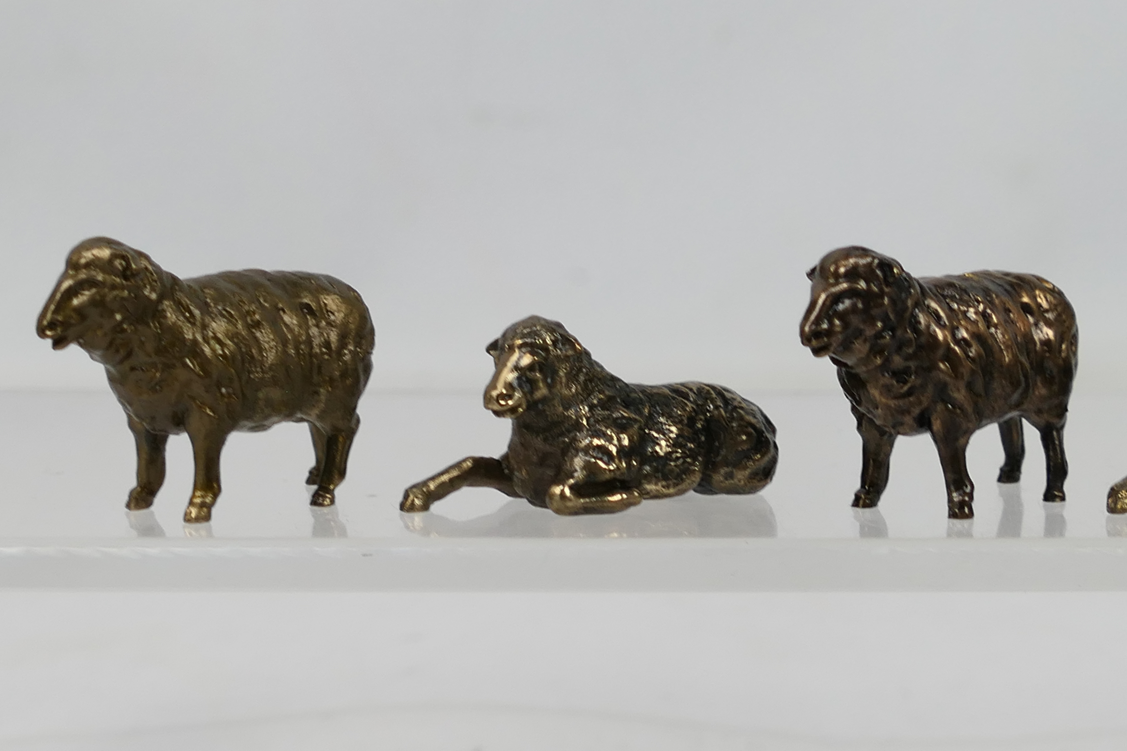 8 x small bronze sheep figures. All in s - Image 2 of 5