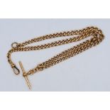 A 9ct rose gold chain and T-bar, 44 cm (l), approximately 34.7 grams / 1.