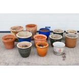 A group of 13 x ceramic and clay plant pots.