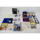 Lot to include various commemorative coins, coin covers, replica Order of St Silvester and other.