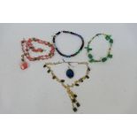 A group of modern semi-precious stone set necklaces including unused examples still with tags and a