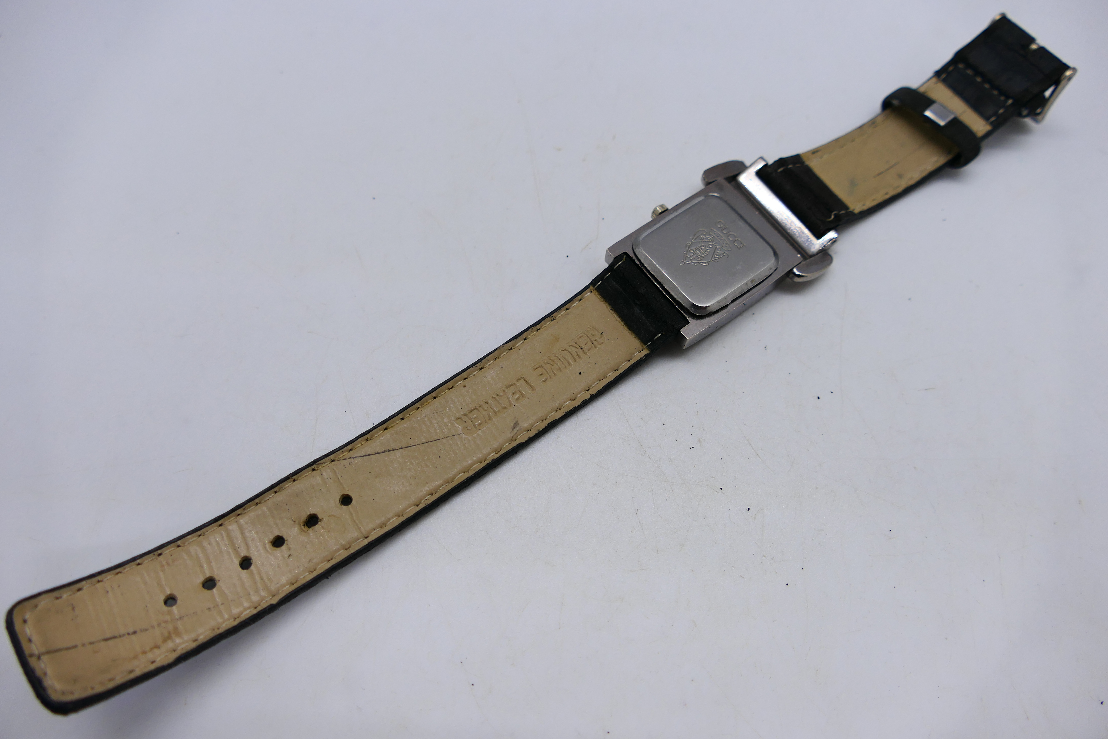 A lady's fashion watch, marked Gucci to the black dial, on black leather strap. - Image 3 of 3