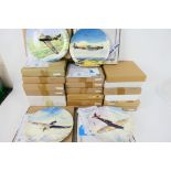 A large quantity of boxed collector plates,