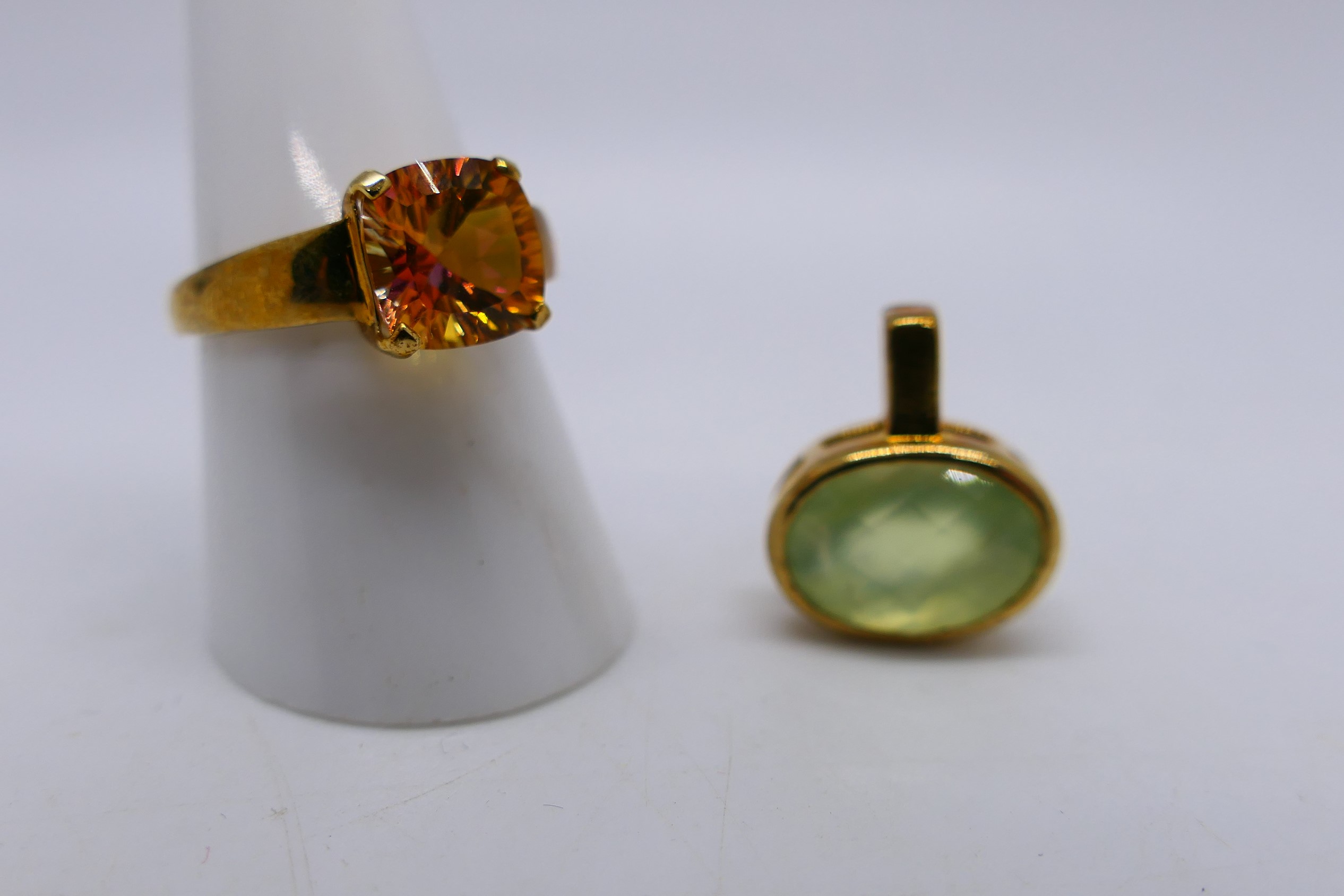 A 9ct gold stone set dress ring, size O+½, 2.3 grams and a stone set yellow metal pendant. - Image 2 of 5