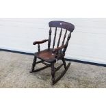 Child's Rocking Chair. A wooden, children's rocking chair.