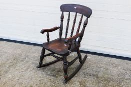 Child's Rocking Chair. A wooden, children's rocking chair.