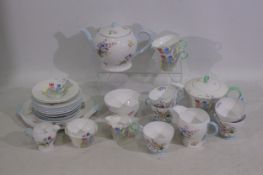 Shelley - A Shelley wild flowers tea service to include teapots, cream jugs, cups, and plates.
