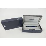 Parker - A Duofold fountain pen in blue with 18k nib, contained in original box with outer card box.