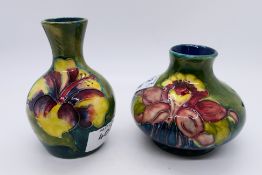 Moorcroft Pottery - Two small Moorcroft Pottery vases comprising a squat example decorated in the