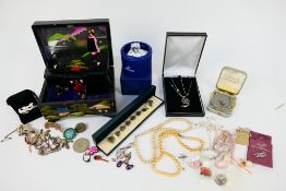 Costume jewellery, a jewellery box and a boxed Swarovski Crystal owl.
