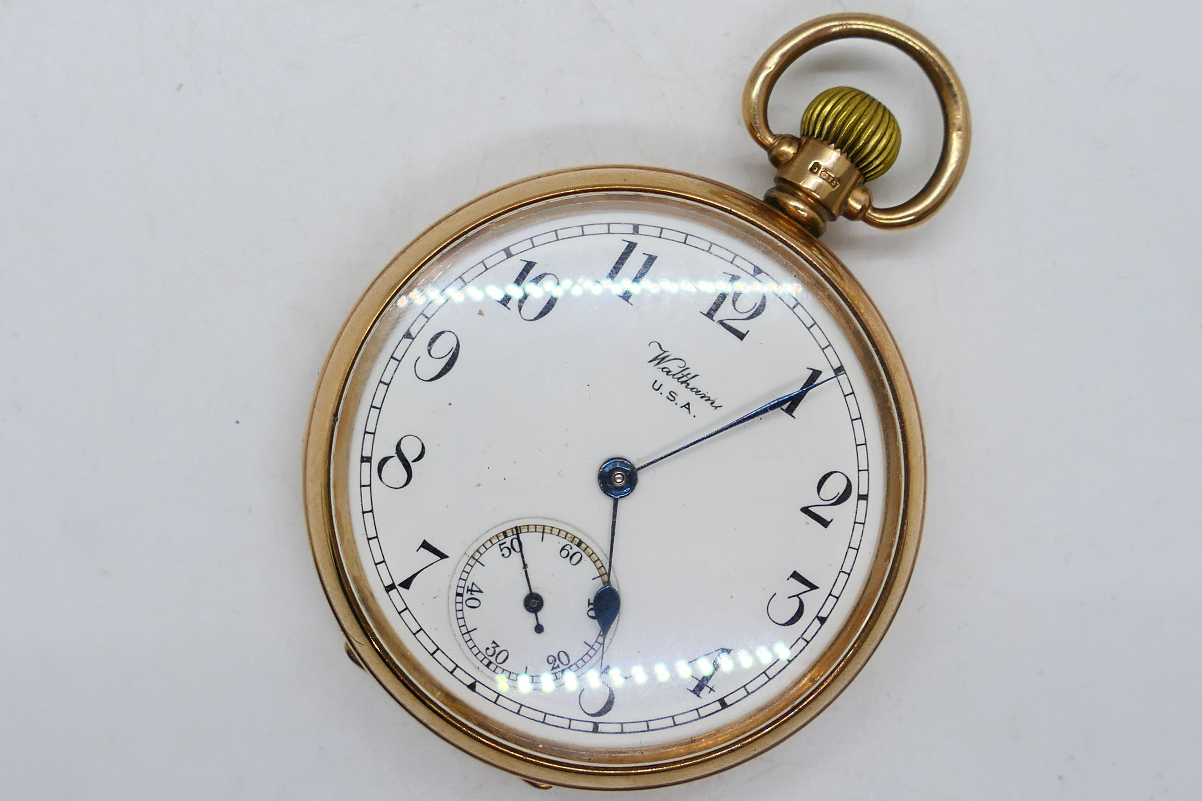 A 9ct rose gold cased open face pocket watch by Waltham,