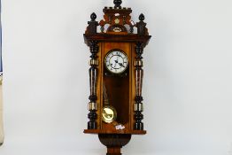 A Vienna style wall clock, the case with turned decoration, glazed door,