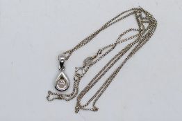 A 9ct white gold and diamond set pendant on 9ct white gold chain, 46 cm (l), approximately 1.