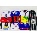 A collection of child size replica football shirts to include England, France, Brazil,