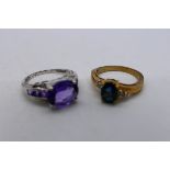 Two 9ct gold stone set rings comprising a white gold example set with purple stones,