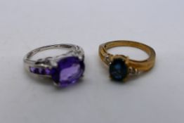 Two 9ct gold stone set rings comprising a white gold example set with purple stones,