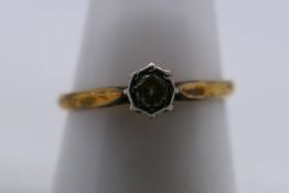 A yellow metal ring, stamped 18ct PLAT, with solitaire illusion set diamond, size Q, 2.2 grams.