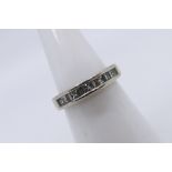A platinum (950) and diamond ring with approximately 50pts princess cut and baguette cut diamonds,