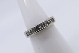 A platinum (950) and diamond ring with approximately 50pts princess cut and baguette cut diamonds,