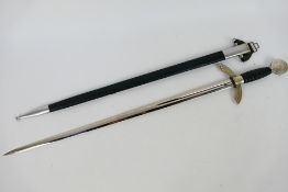 A post war example of a Luftwaffe officer's dress sword with scabbard, 67 cm (l) blade.