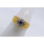 A yellow metal stone set ring, stamped 18ct, size N, approximately 3.7 grams.