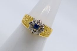 A yellow metal stone set ring, stamped 18ct, size N, approximately 3.7 grams.