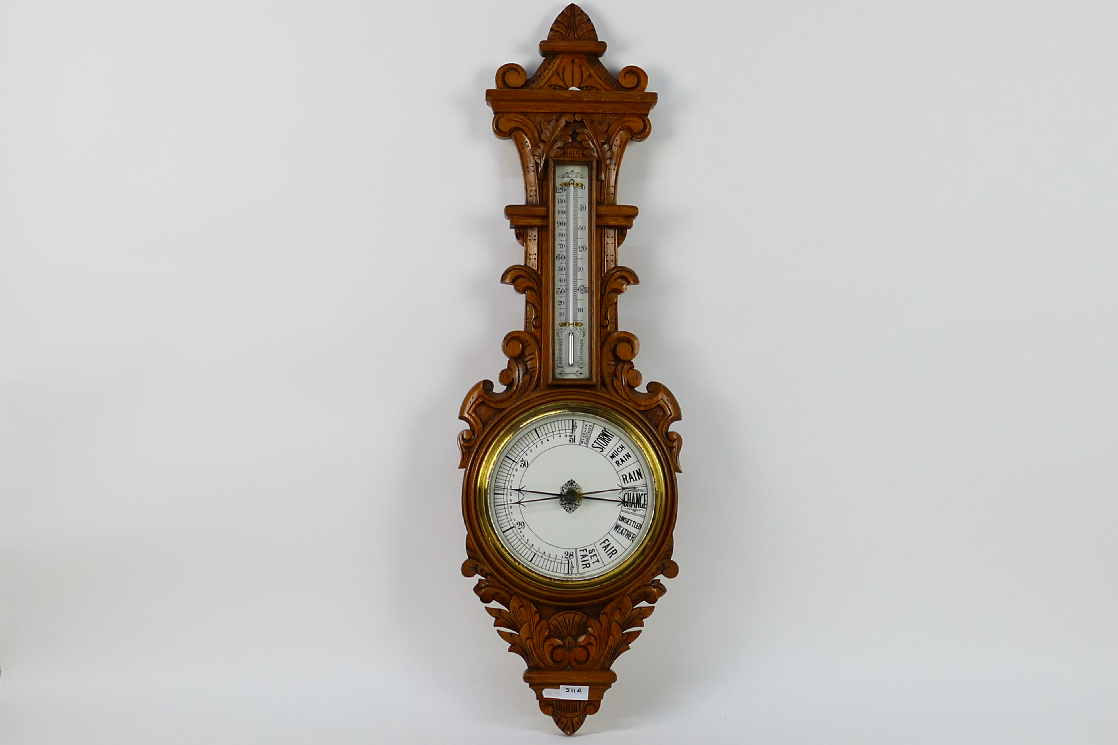 An oak cased banjo barometer / thermometer, 88 cm (h).