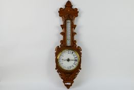 An oak cased banjo barometer / thermometer, 88 cm (h).