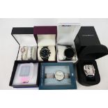 A quantity of boxed fashion watches to include Sekonda, Pulsar, Emporio Armani and other.