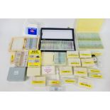 A large quantity of biological / anatomical microscope slides.