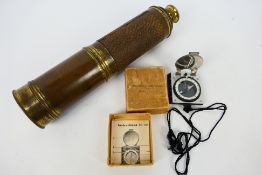 A brass five draw telescope, 96 cm (l) when extended and a German marching compass (boxed).
