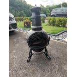 Garden - a cast iron Chiminea with a removable lid and internal grill,