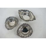 Three Victorian hallmarked silver trinket dishes all having embossed and pierced decoration,