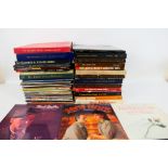 A collection of 12" vinyl records to include Frank Sinatra, Klaus Wunderlich, Gilbert and Sullivan,