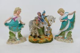 A pair of European ceramic figures depicting young girls,