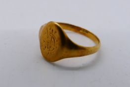 A yellow metal ring, stamped 18ct (shank cut), 3.