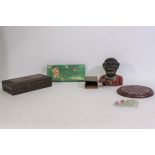 A vintage cast iron money bank, wooden solitaire board, carved wood trinket box and other.