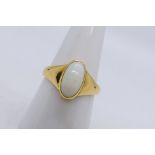 A yellow metal ring presumed 18 ct gold set with single white oval opal cabochon, size O+½,