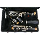 An Earlham clarinet contained in hard case.