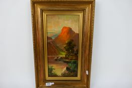 A framed oil on canvas landscape scene, Highland loch scene, signed lower left J Ducker,