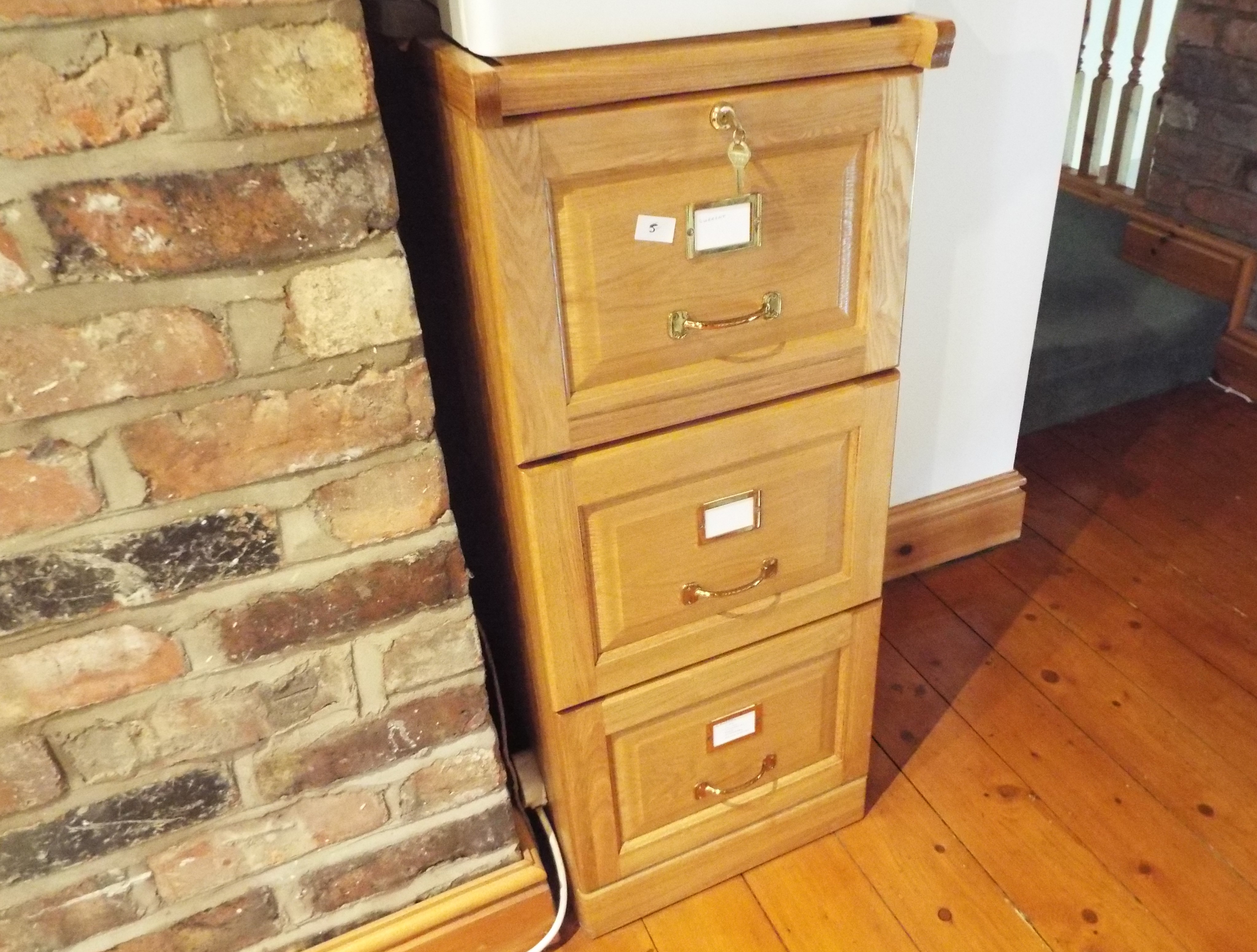 A good pine filing cabinet having three drawers, 100 cm (h) x 40.5 cm (w) x 44.