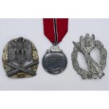 Three World War Two (WW2 / WWII) style German decorations comprising an Infantry Assault Badge,