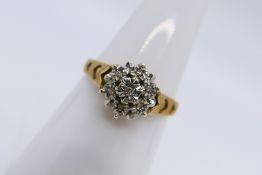 A 9ct yellow gold and diamond ring,