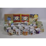 A collection of Rupert bear collectable items to include tins, money banks, ceramic cups,