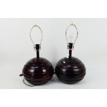 A pair of table lamps with turned wood bases, approximately 56 cm (h).