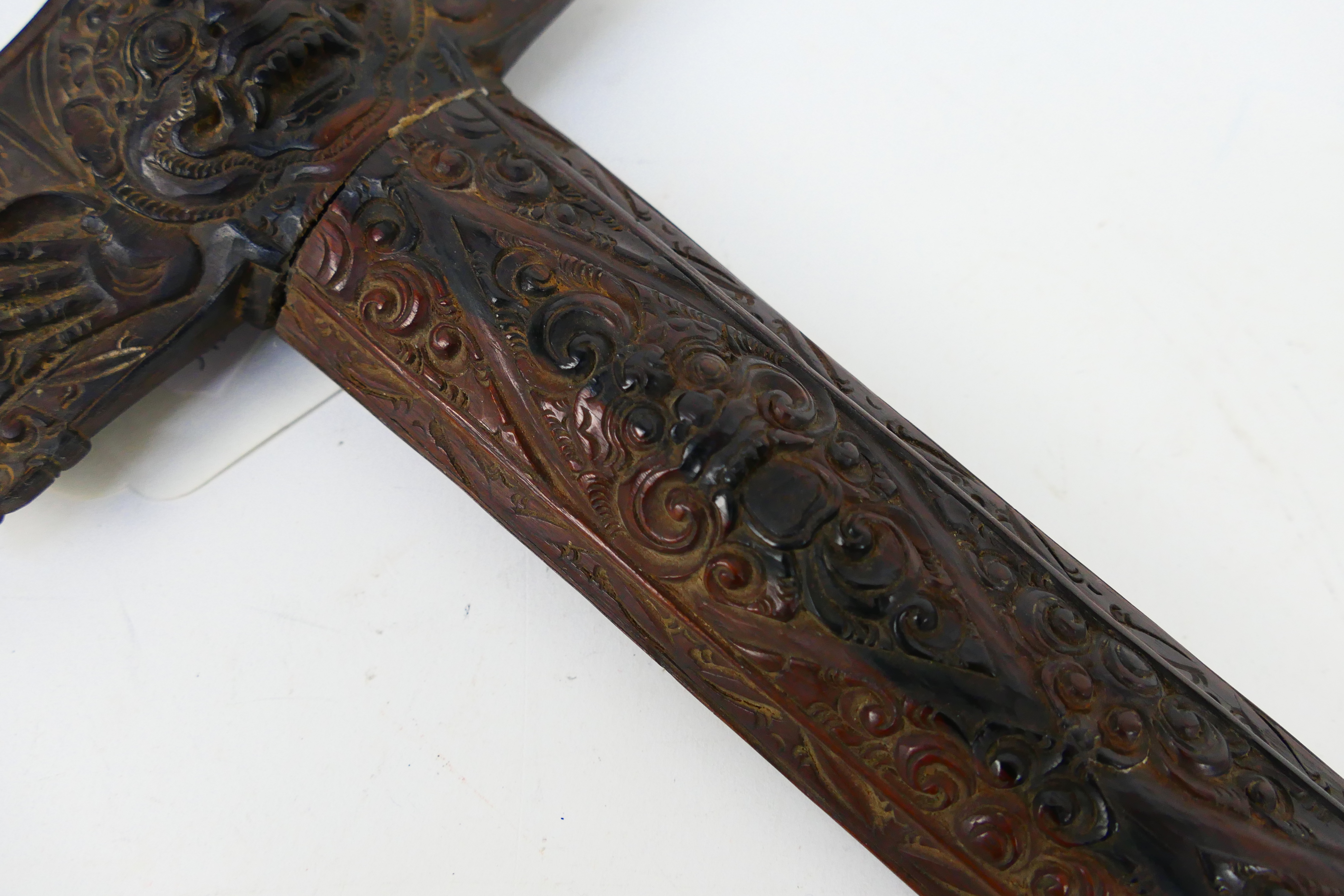 An Indonesian Kris with intricately carved scabbard and hilt, - Image 8 of 9