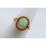 A 9ct yellow gold opal solitaire ring,